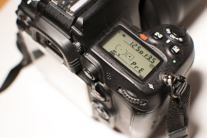 A close up of setting white balance on a Nikon camera