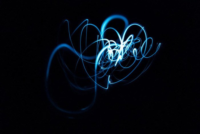 Blue streaks of light painting on a black background