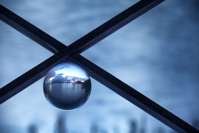 A creative shot of a minimalist landscape landscape within a crystal ball.