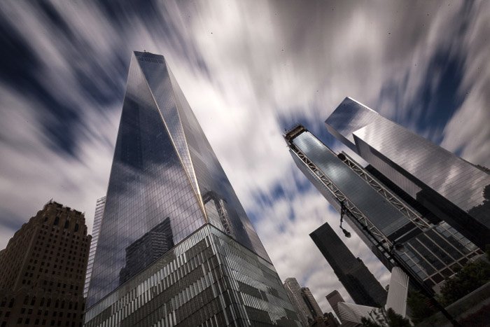 Clouds moving across the sky at the One World Trade Centre in New York, shot using slow shutter speed