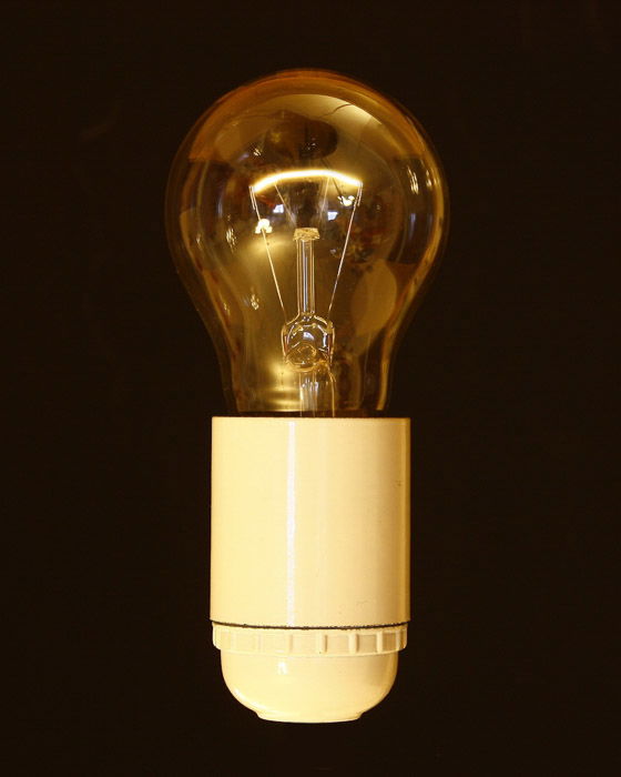 A Tungsten Light bulb against black background - types of studio lights