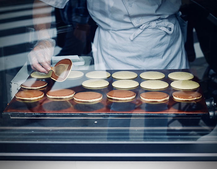 A close up portrait of a chef preparing food - cool travel pictures of japan