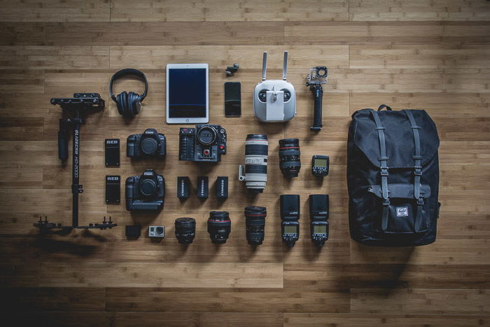 A flat lay photo of photography equipment