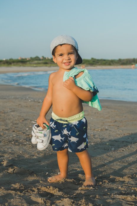 A sweet portrait of a little boy on a beach
