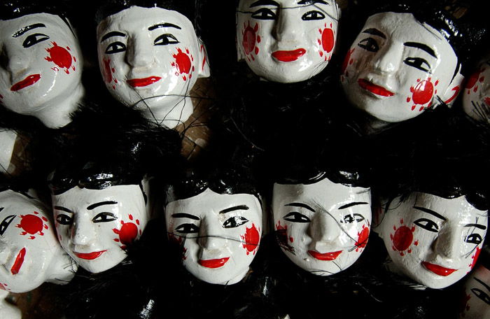 Overhead view of painted doll heads 