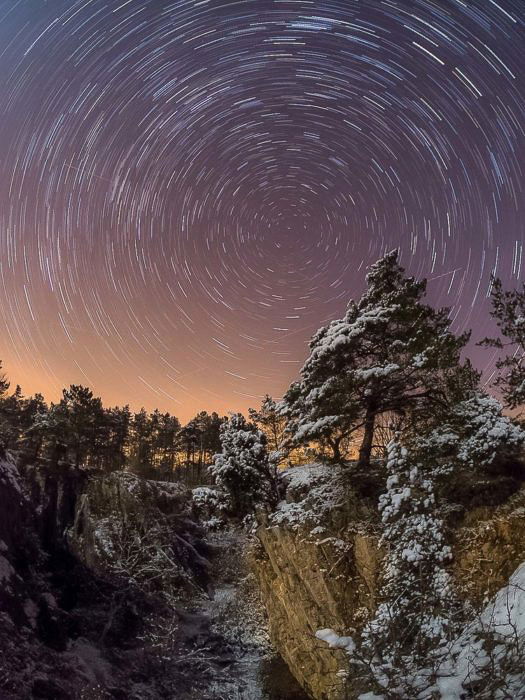 compelling star trails over a stunning landscape - astrophotography tools 