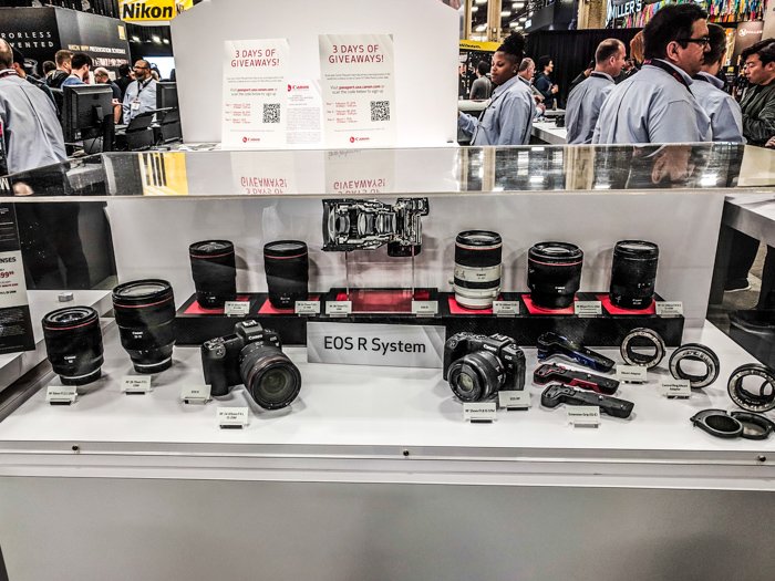 A display case featuring the Canon EOS system products including the new Canon RF lenses for mirrorless camera 
