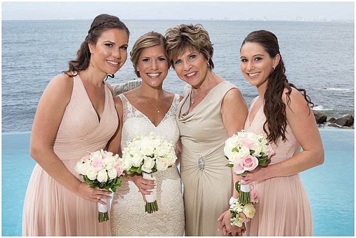 A wedding portrait of the bride and bridesmaids posing outdoors - wedding flash photography