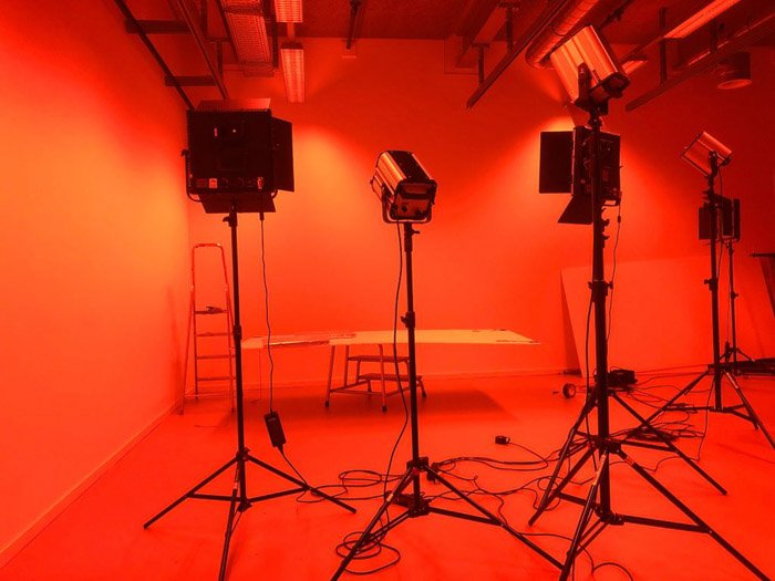 Studio lighting setup in orange light 