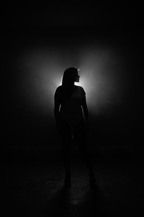 Film noir photography portrait of a female model in monochrome