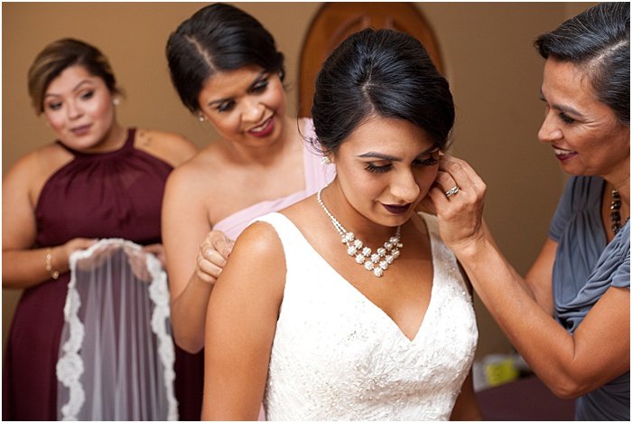 A wedding portrait of the bride getting prepared for the big day - wedding flash photography