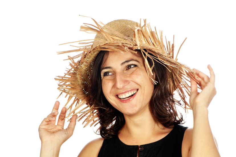 Smiling woman wearing a straw hat