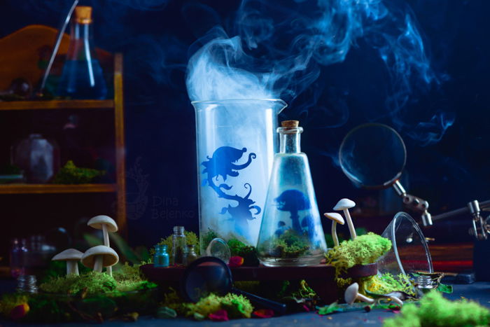 A creative still life featuring a spooky scientific experiment with smoke and silhouettes