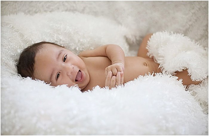 A sweet portrait of a newborn baby taken in a portable photo studio