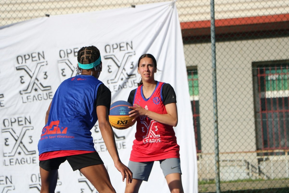 Two players squaring off in an outdoor pick-up game as an example of basketball photography