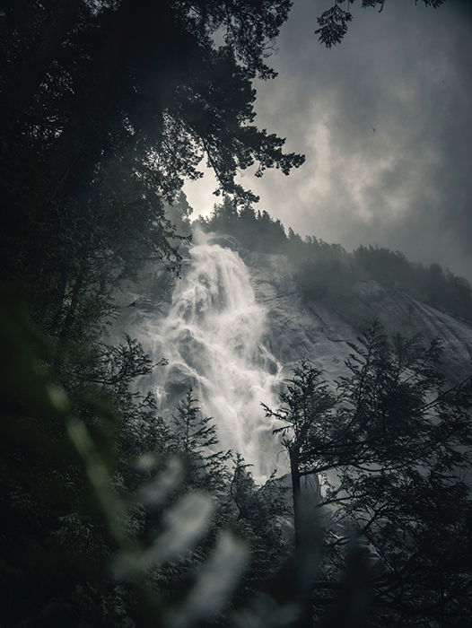 Atmospheric shot of a flowing waterfall on a cloudy day - beautiful photography principles