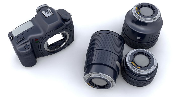 Overhead view of a camera body and three lenses