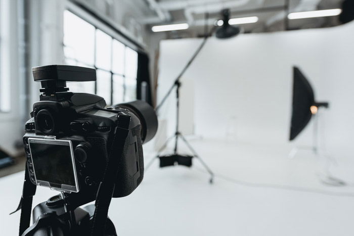 A DSLR on a trip set up in a photography studio