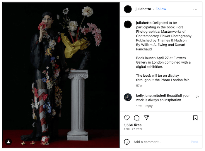 Screenshot of a Julia Hetta Instagram post of a fashion model with an elaborate flower outfit and display