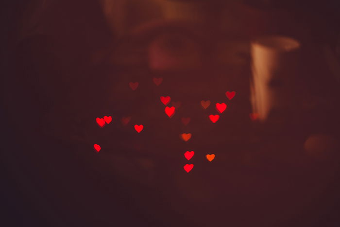 pretty heart shaped bokeh lights on dark background