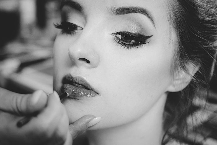 A female model having her make up done for a Hollywood glamour portrait shoot