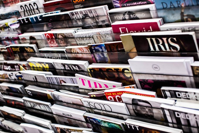 racks of photography magazines in a store 