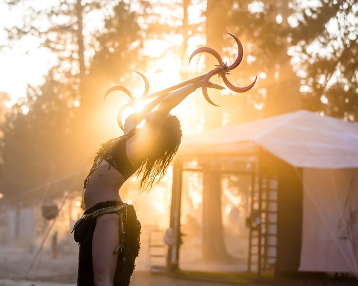 Atmospheric portrait of a dancer performing outdoors at a festival