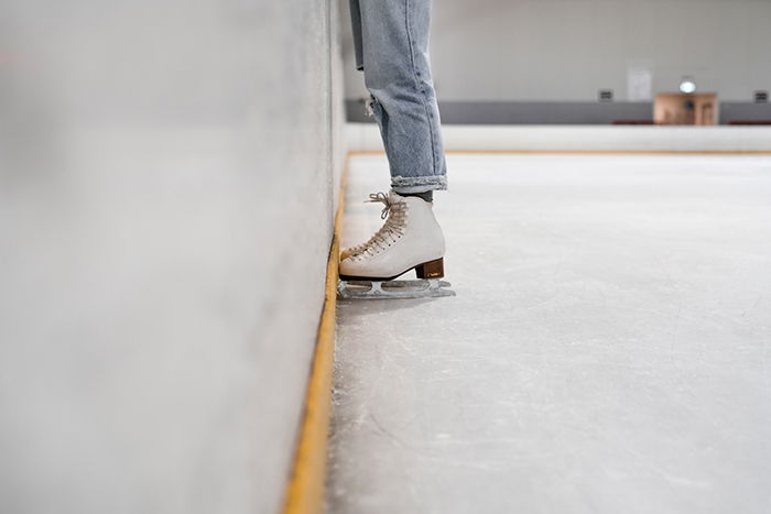 A close up of an ice skaters feet 