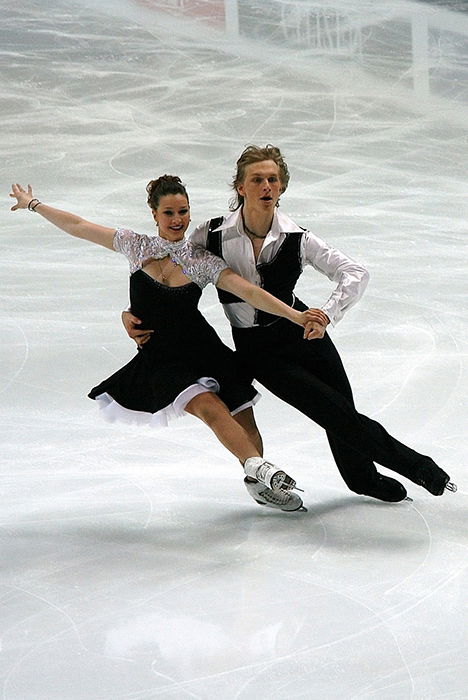 Beautiful figure skating photography of a couple dancing on the ice