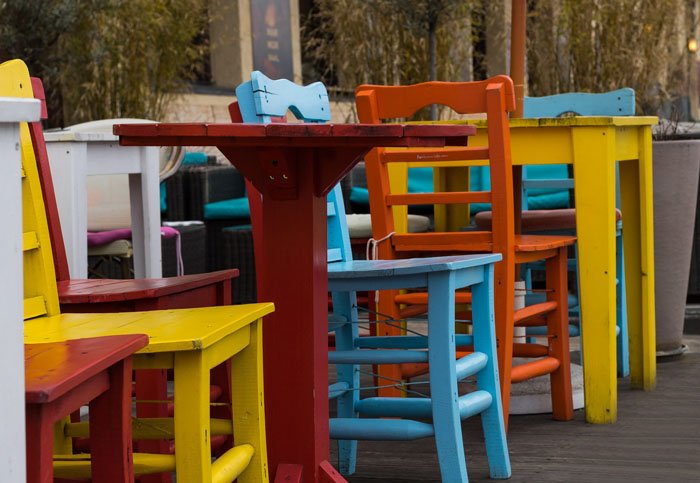 Colorful outdoor cafe and chairs using triadic colors