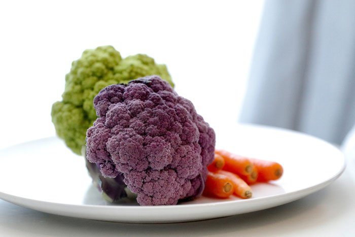 Bright and airy photo of vegetables on a plate using triad colors