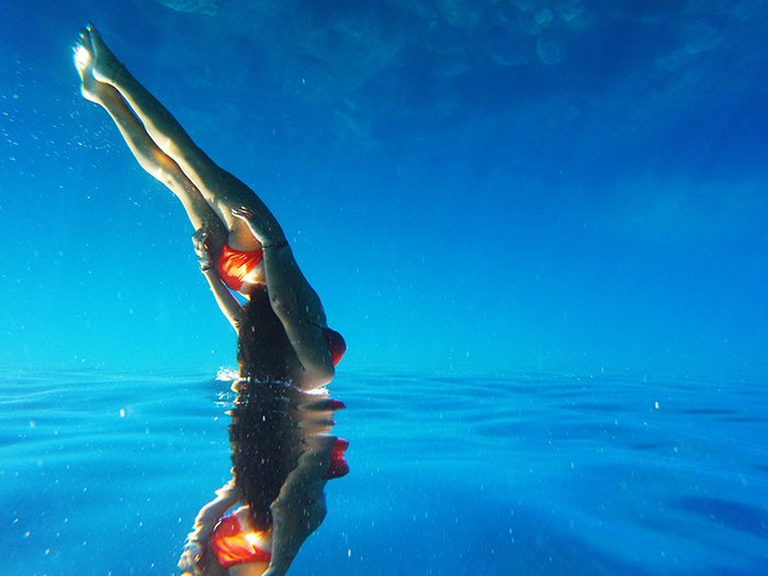 a stunning underwater portrait of a female swimmer 