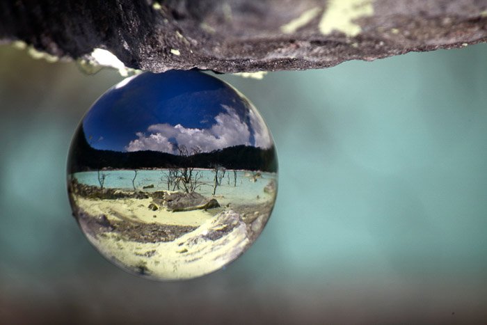 stunning crystal ball photography shot of an acid lake-volcano and lava photography