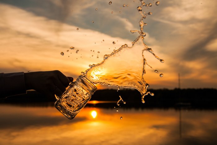 Creative water splash photography at a sunset outdoors 