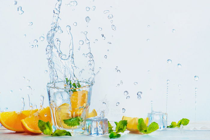 Cool summertime themed still life featuring citrus fruit and water splash