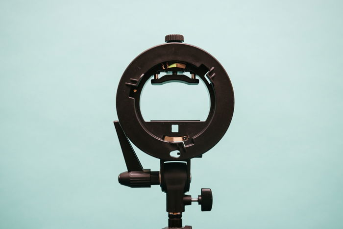 An S-type speedlight mount. three point lighting