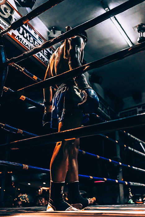 Atmospheric boxing picture of a fighter in the ring during a match