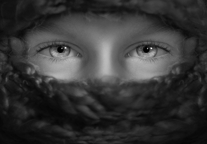 A monotone portrait of a female models eyes featuring stunning catchlights