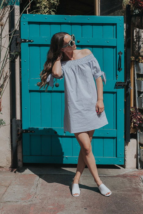 A female fashion model posing outdoors for a fashion lookbook shoot