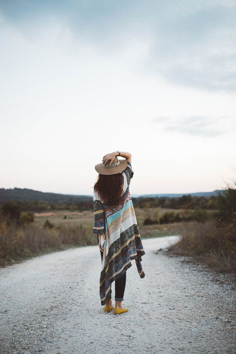 A female fashion model posing outdoors for a fashion lookbook shoot