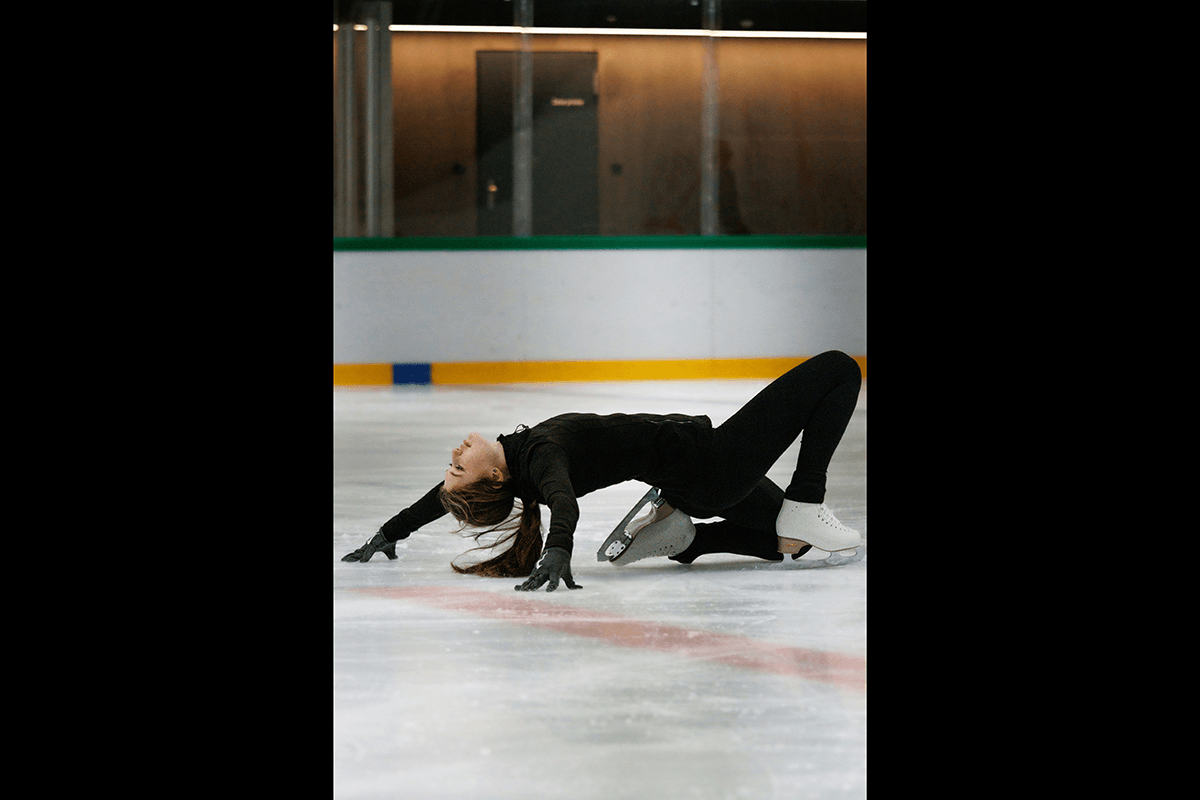 A skater bending backward on the ice as an example of figure skating photography