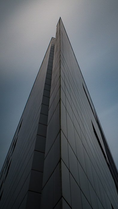 Architecture photography image of a tall skyscraper against a cloudy sky - lightroom auto mask