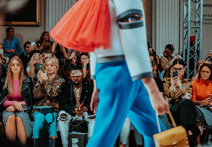 A model walking the catwalk during a fashion show 