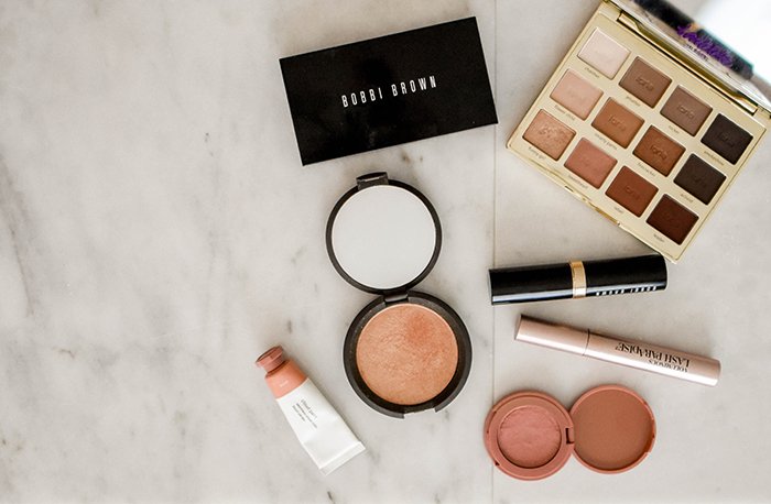 Flat lay of cosmetics for a makeup product shoot