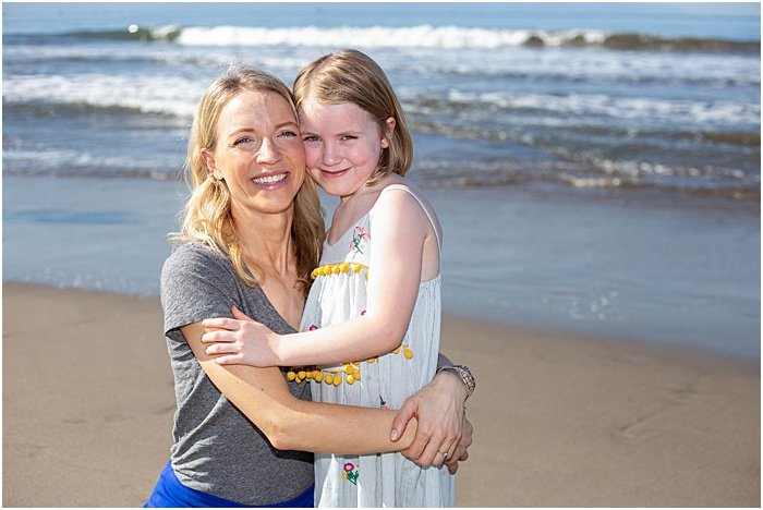 A mother daughter photoshoot outdoors on the beach