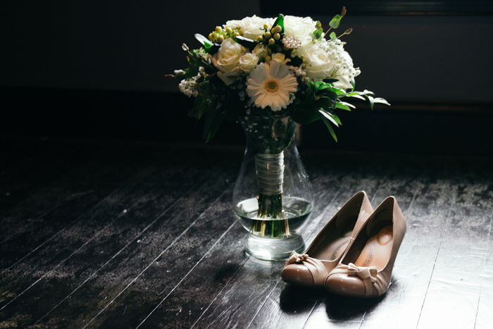 atmospheric still life of wedding shoes and flowers - wedding photography business tips