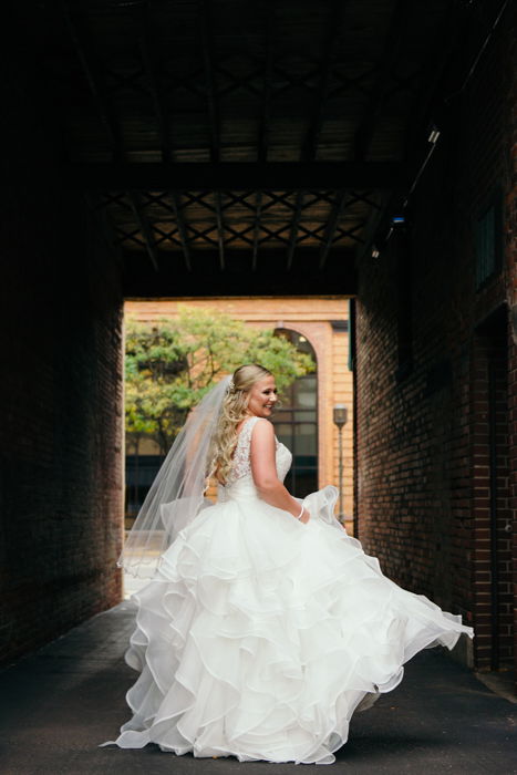 Wedding portrait of the bride posing outdoors - wedding photography business tips