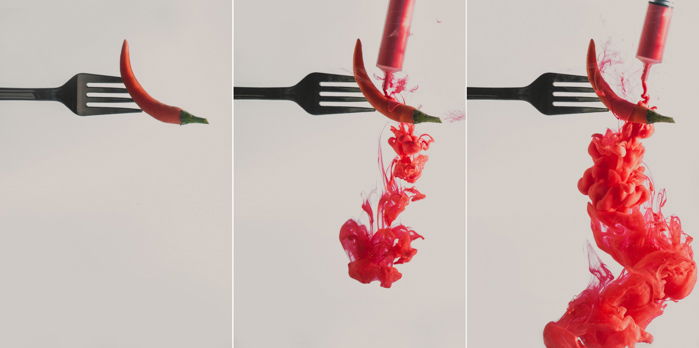 a triptych of a chilli pepper on a fork - setup to shoot colorful paint in water photography