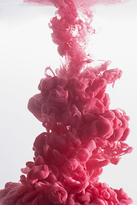 A pink cloud using colorful paint in water technique