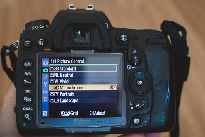 the settings on a Nikon DSLR showing how to shoot in sepia tone